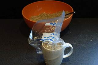 A mug used as a scoop for the vermiculite.