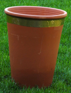 Copper tape fixed around a flower pot